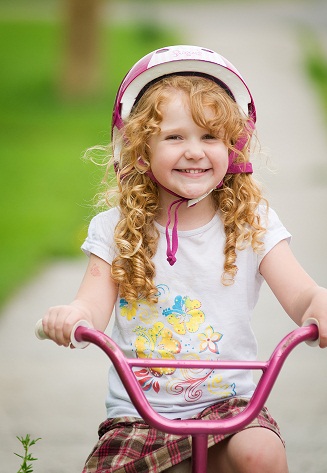 http://www.dreamstime.com/royalty-free-stock-images-happy-girl-her-bike-image18009239